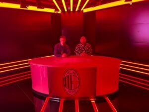 Photo of two employees visiting our client AC Milan in the off season 