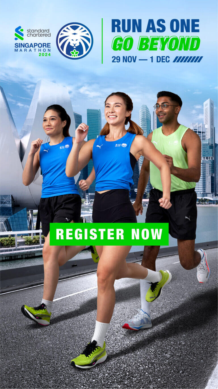 Two females and one male running along a road.